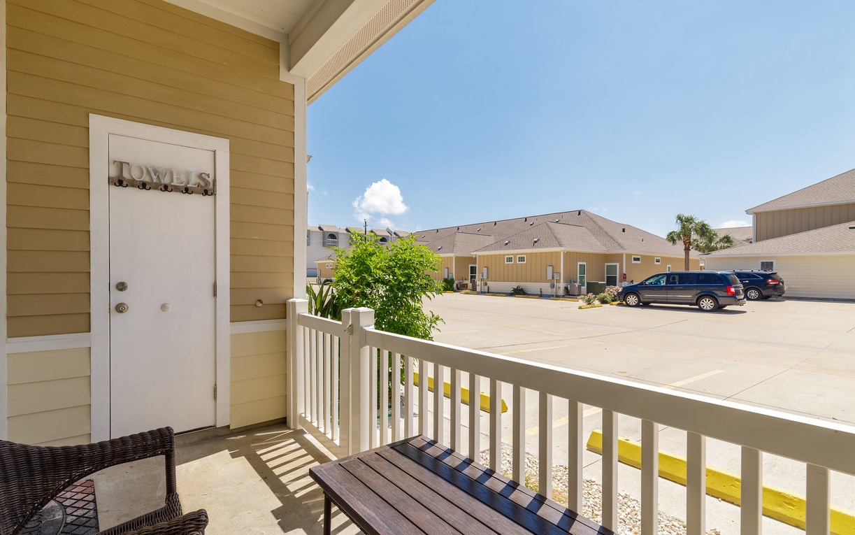 Step onto your private covered balcony and enjoy the peaceful courtyard view with outdoor seating for morning coffee or evening relaxation.