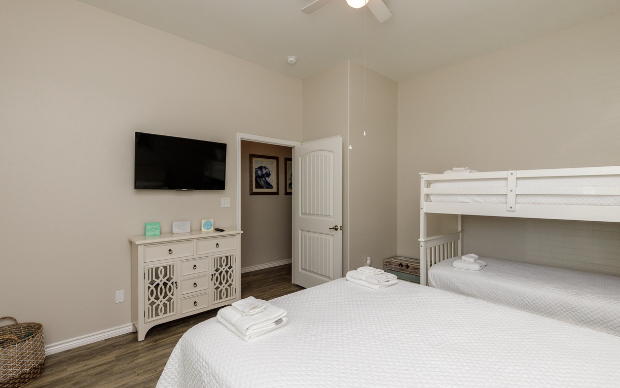 Your family room features comfortable bedding, entertainment, and thoughtful amenities for a perfect stay together.