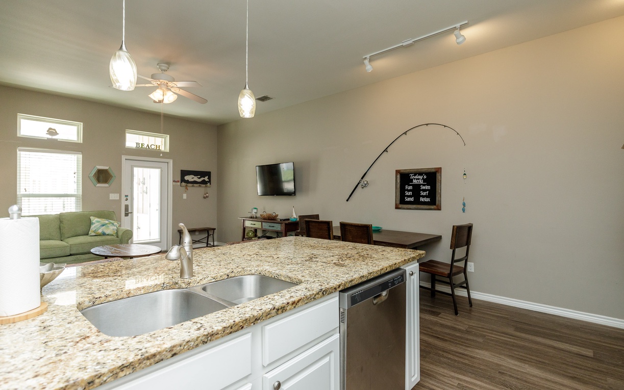 Your open-concept kitchen features granite countertops and modern appliances, flowing seamlessly into the living area where you'll relax and create lasting memories.