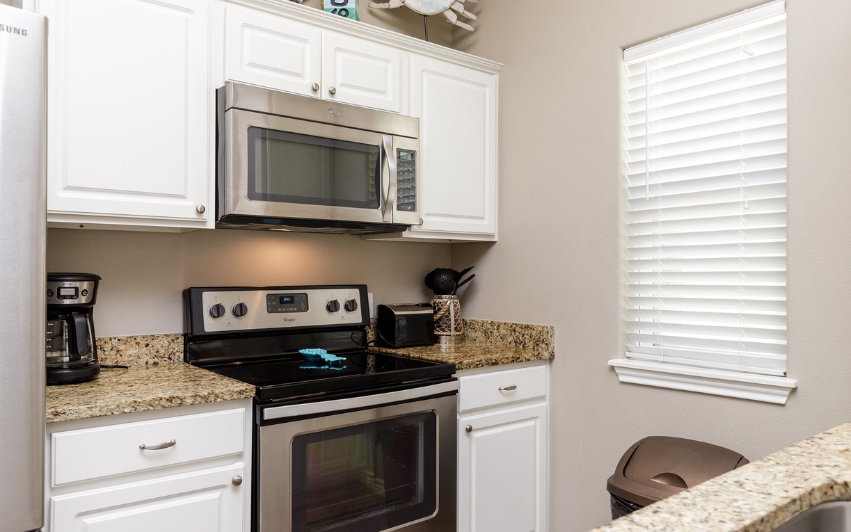 Your fully equipped kitchen features granite countertops, stainless steel appliances, and everything you need to prepare memorable meals during your stay.