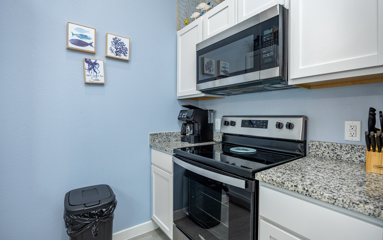 Your fully equipped kitchen features modern appliances and coastal-themed touches, making meal prep a breeze during your stay.
