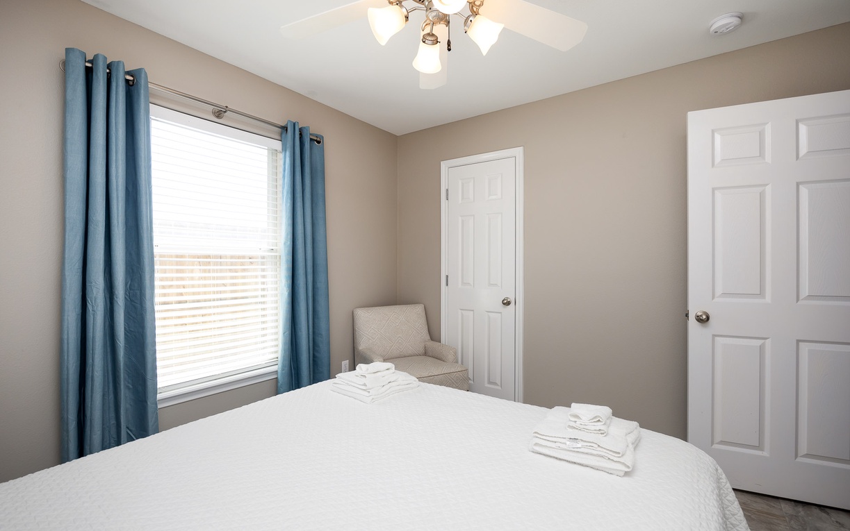 Your peaceful bedroom sanctuary features fresh linens and soft natural light for the perfect night's rest.