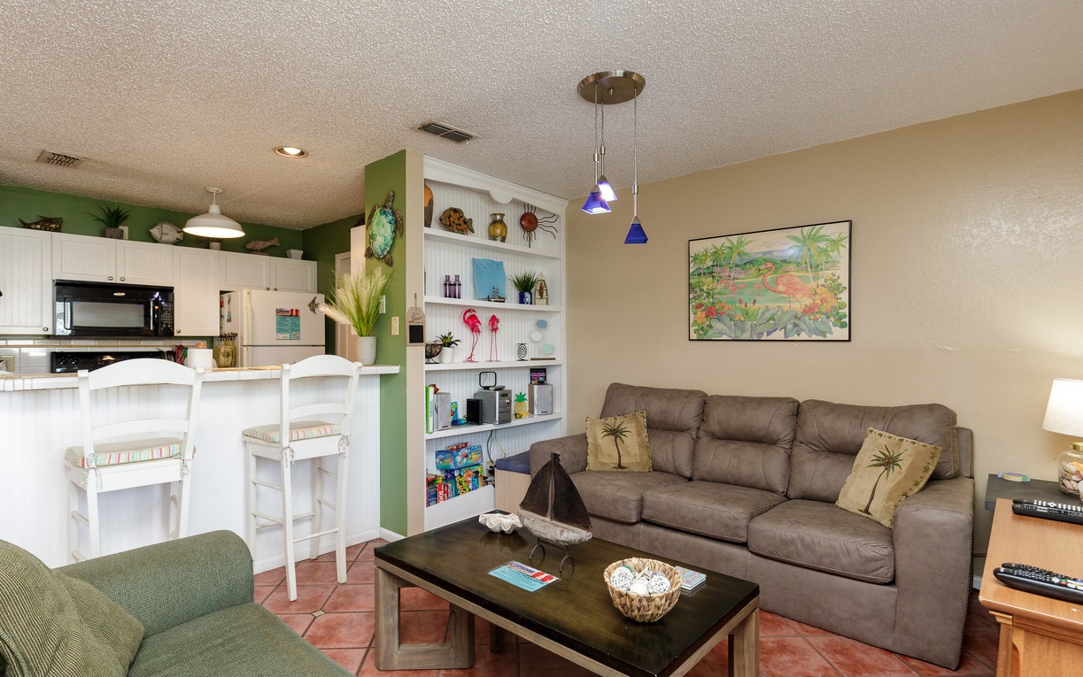 Unwind in your tropical-themed living space with plush seating and colorful accents that bring island vibes indoors.