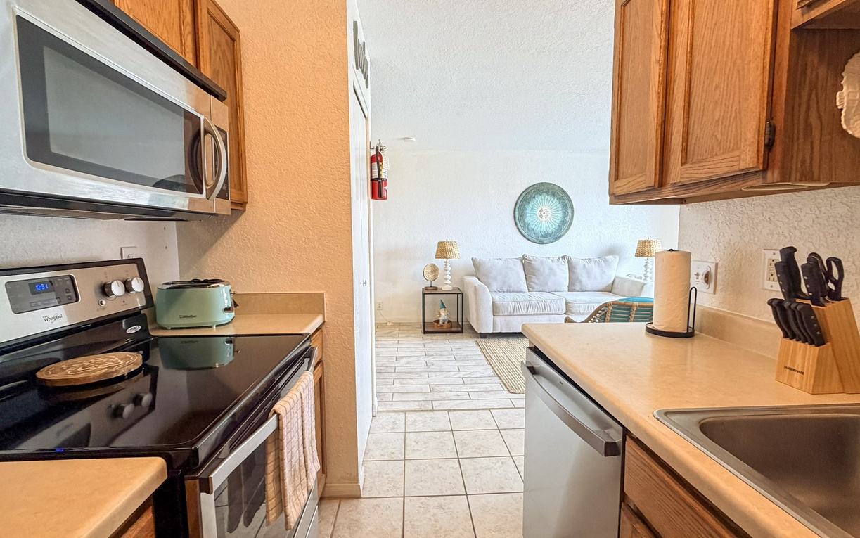 Your fully equipped kitchen opens to a bright living space, perfect for preparing meals while staying connected with loved ones.