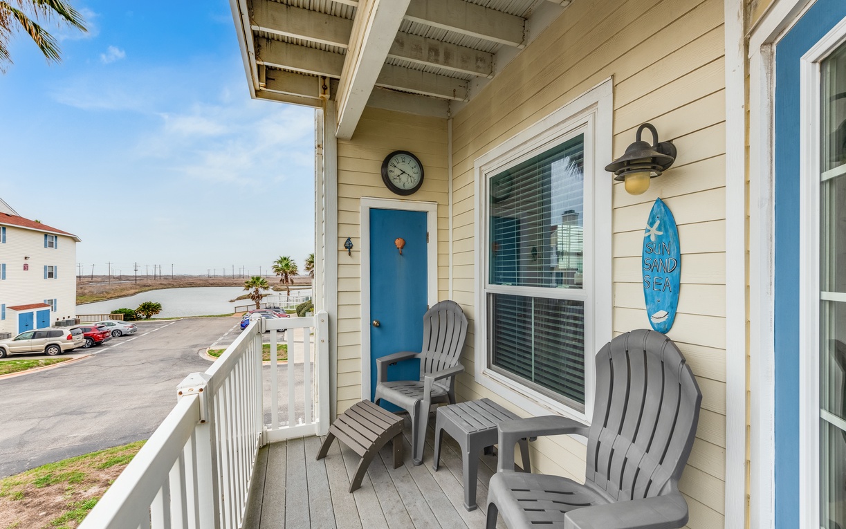 Step onto your private balcony with comfy Adirondack chairs—perfect for morning coffee while watching the marina come alive below.