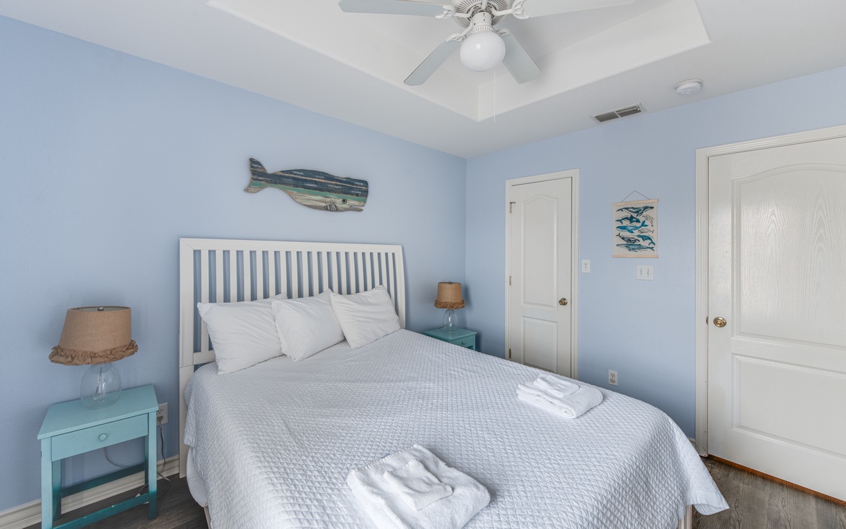 Drift off to peaceful dreams in your coastal-inspired bedroom, where ocean-blue walls and marine artwork create a tranquil seaside sanctuary.