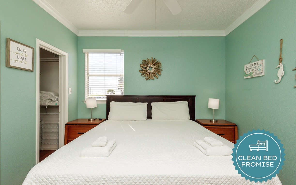 Unwind in your serene bedroom with fresh mint walls, crisp white linens, and coastal touches that invite peaceful dreams.