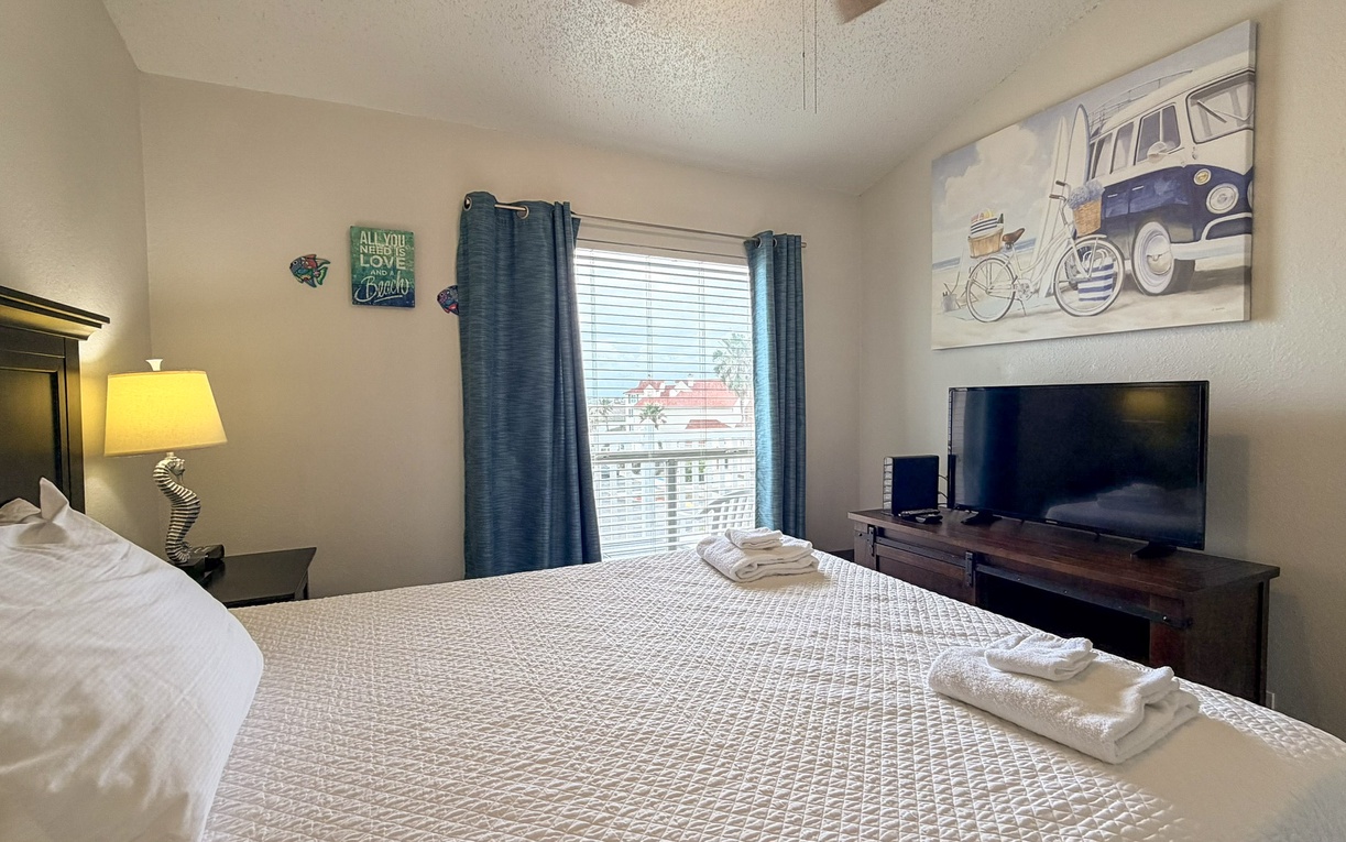 Sink into your comfortable bed with crisp linens and enjoy your favorite shows on the flat-screen TV in this thoughtfully decorated bedroom.