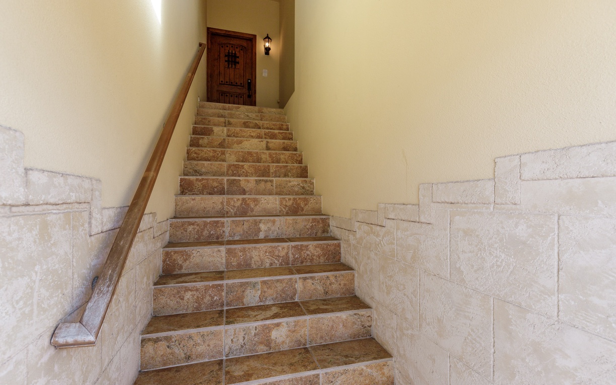 Climb these beautiful stone steps to your private entrance, where rustic charm meets comfort in every detail.