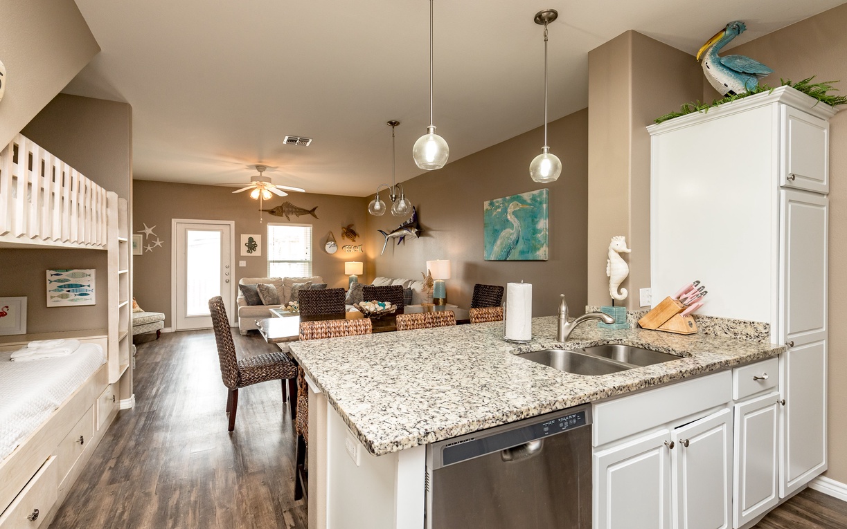 Your open-plan kitchen flows into the living area, perfect for preparing meals while staying connected with family and friends.