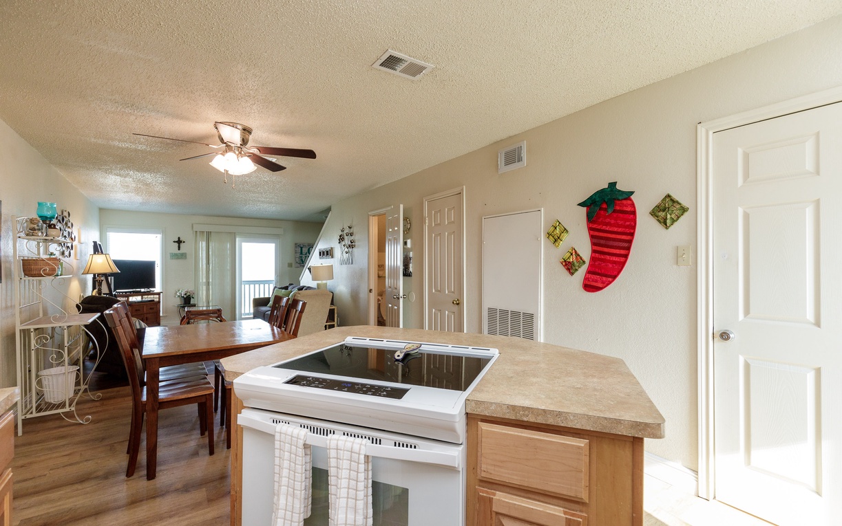 Your open-concept kitchen flows seamlessly into the dining area, perfect for preparing meals while staying connected with family and friends.
