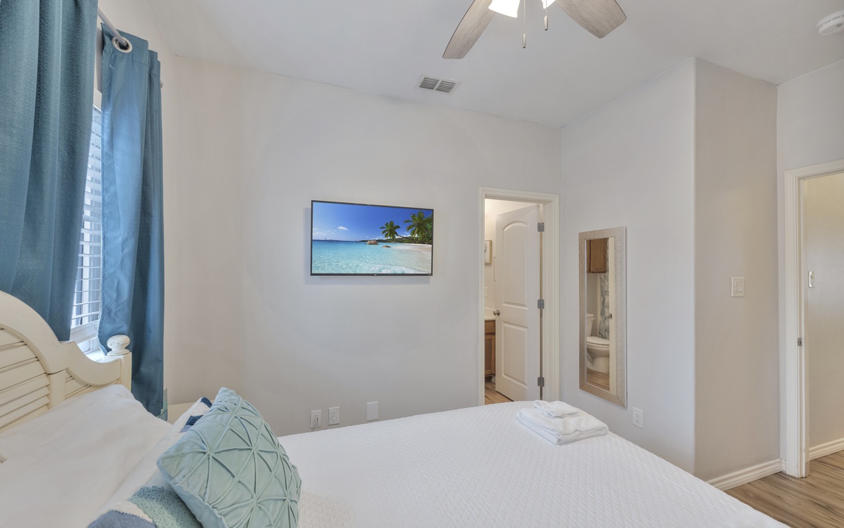 Unwind in your bright, airy bedroom with coastal touches and a private ensuite for ultimate comfort.