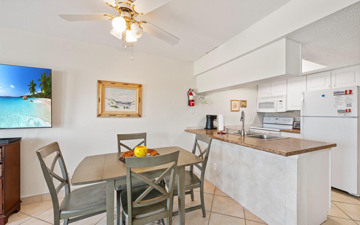 Your bright, open-concept kitchen and dining area features modern appliances and cozy seating for memorable meals together.