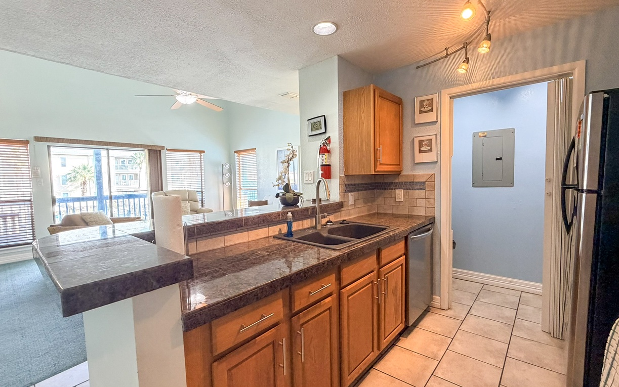 Your fully-equipped kitchen awaits with granite counters and everything you need to create memorable meals together.