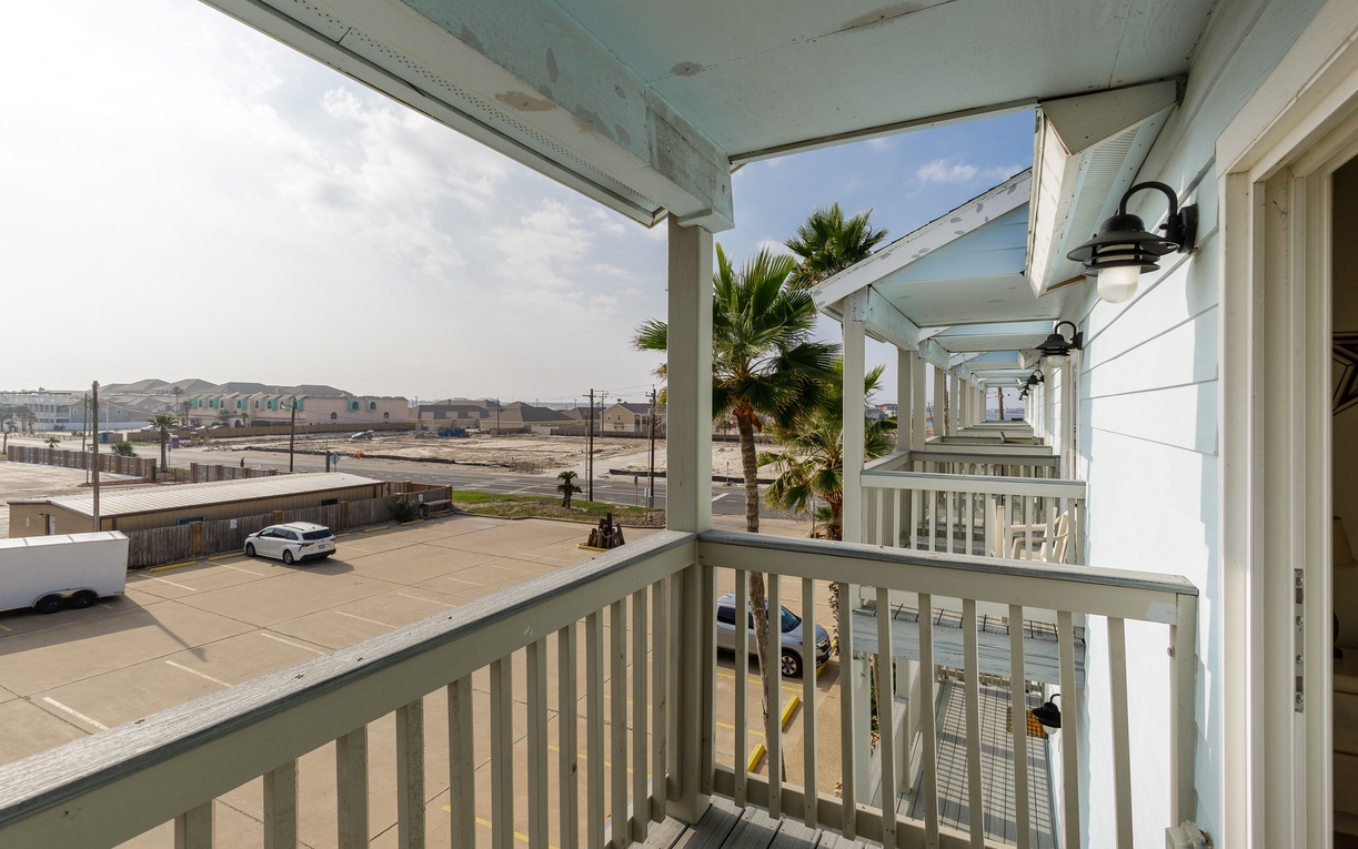 Step onto your private balcony and breathe in the coastal air while taking in views of the surrounding neighborhood and palm trees.
