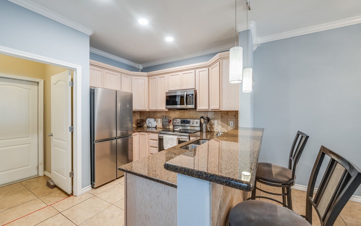 Your modern kitchen awaits with granite counters and sleek appliances for effortless meal prep.
