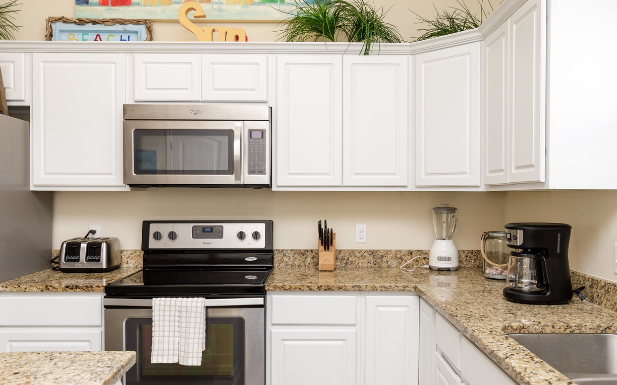 Your fully equipped kitchen awaits with granite counters, stainless appliances, and everything you need to prepare memorable meals during your stay.