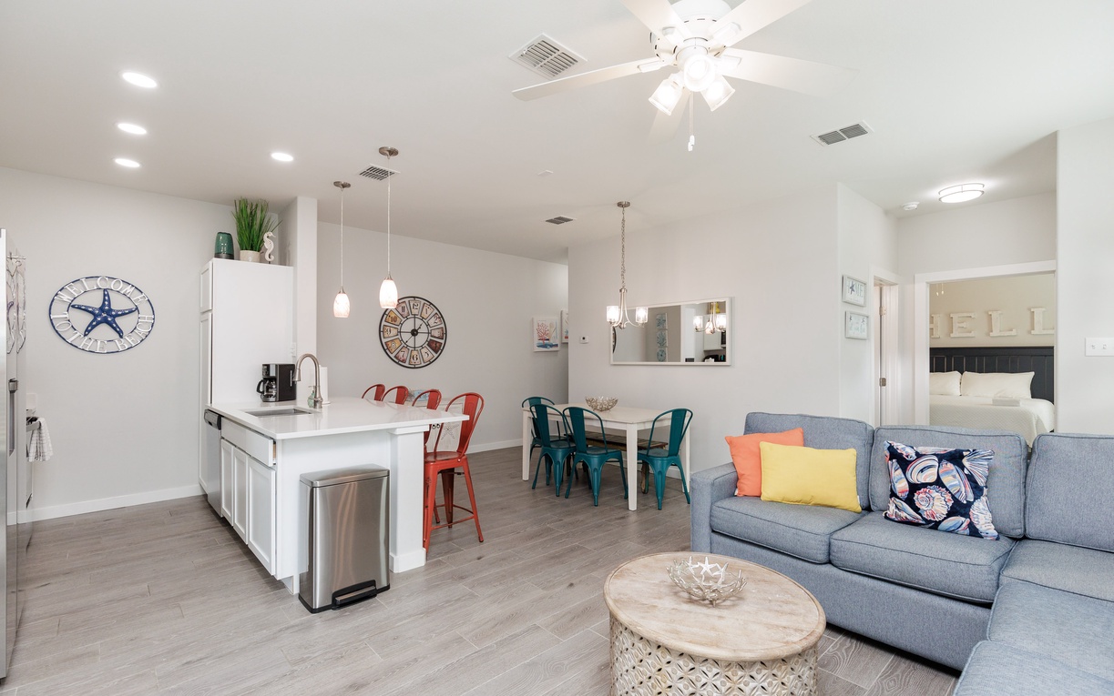 Your bright, open living space flows seamlessly from kitchen to dining to lounge, creating the perfect gathering spot for relaxation.
