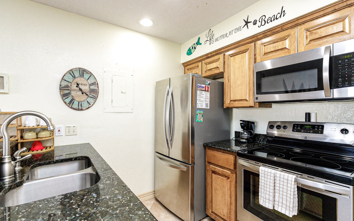 Prepare delicious meals in your fully equipped kitchen with granite counters, stainless steel appliances, and charming beach-themed touches.