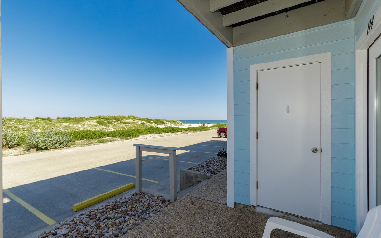 Beachfront entrance with coastal dunes and ocean views just steps from your door.