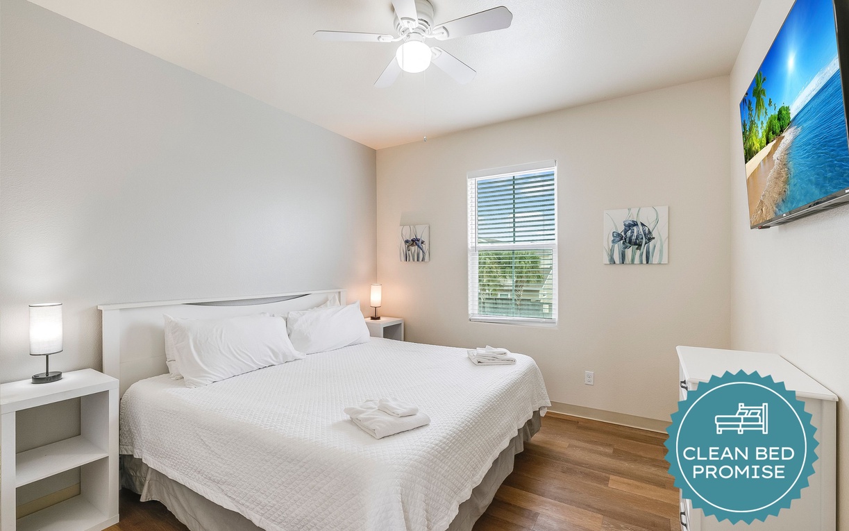 Drift off to peaceful sleep in your bright, airy bedroom with crisp linens and tropical artwork inspiring sweet vacation dreams.