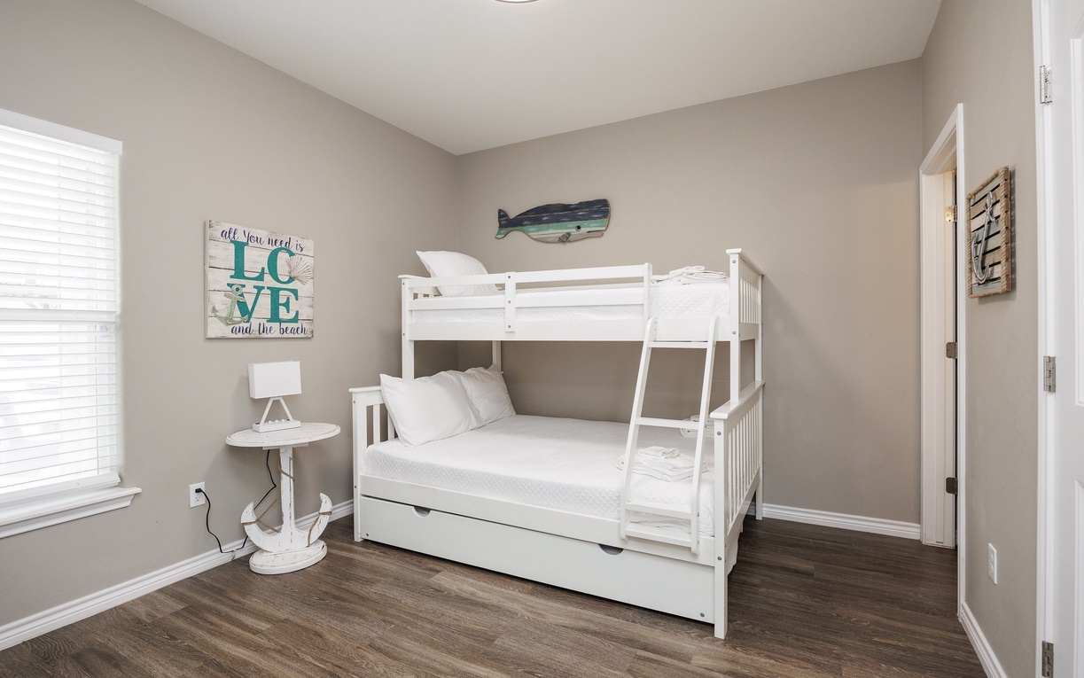 Your kids will love this beach-themed bunk room with a twin-over-full bunk bed and twin trundle.