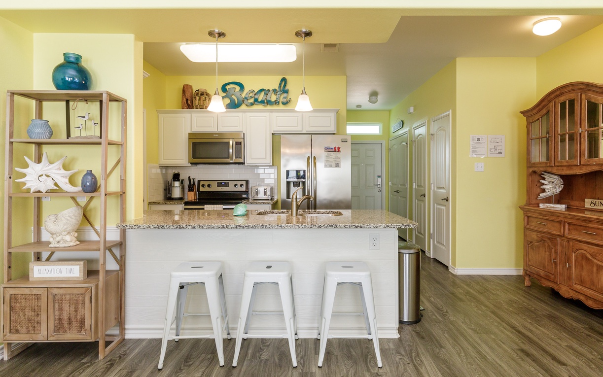 Your bright kitchen features granite countertops, modern appliances, and a breakfast bar where you can sip morning coffee.