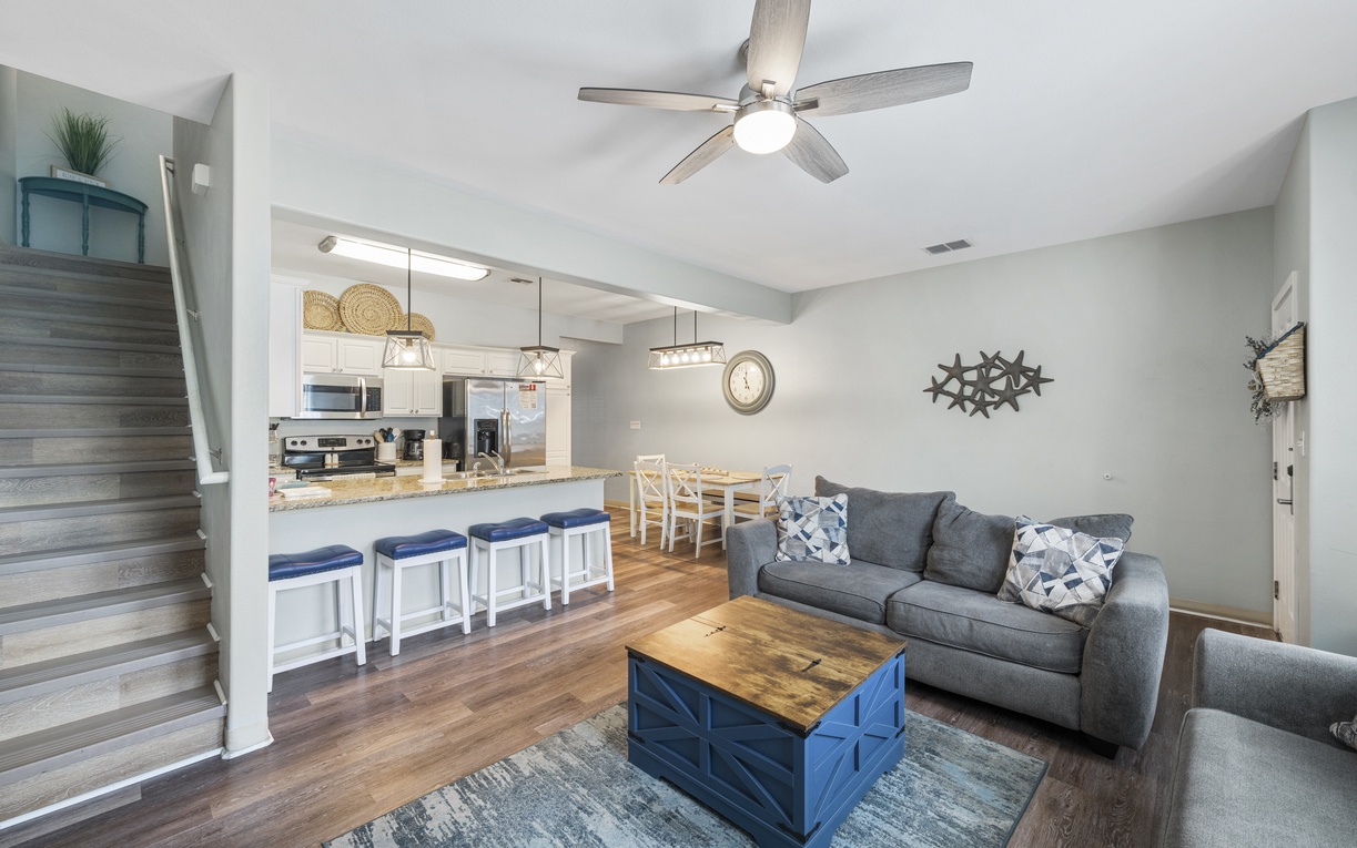 Relax in your spacious living area with cozy seating and an open kitchen perfect for gathering with loved ones.
