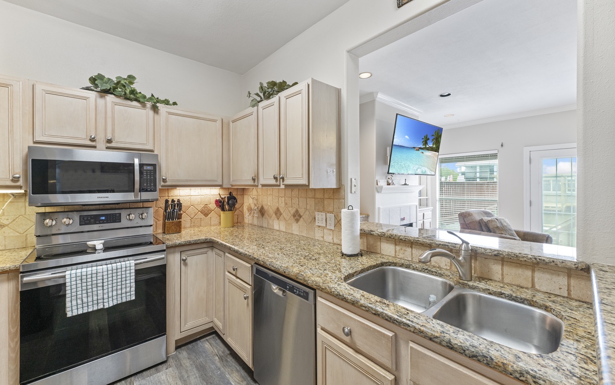 Your fully-equipped kitchen features granite countertops, stainless steel appliances, and everything you need to create memorable meals during your stay.