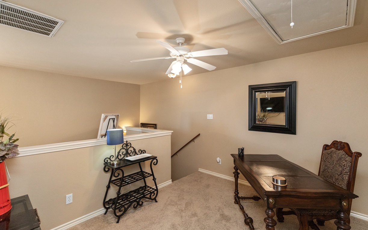 Your private loft office space offers comfortable furniture and ceiling fan to keep you cool while working.