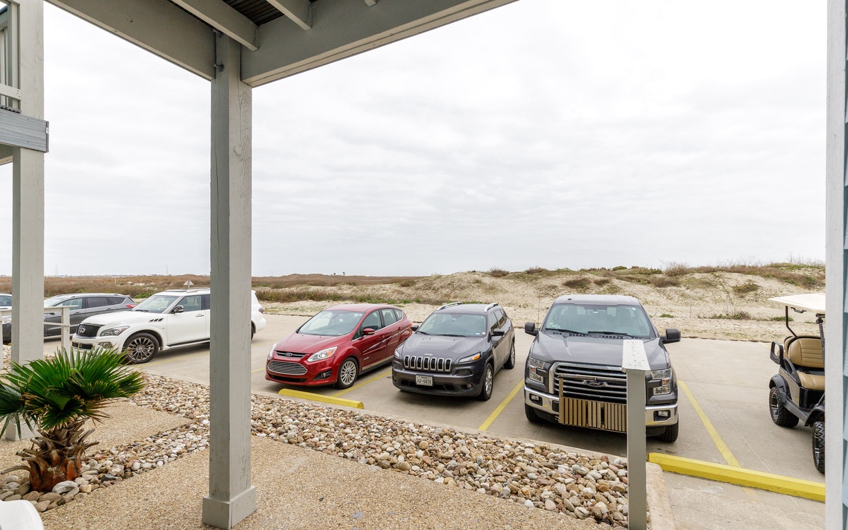 Convenient covered parking with desert landscape views provides easy access to your vacation retreat.