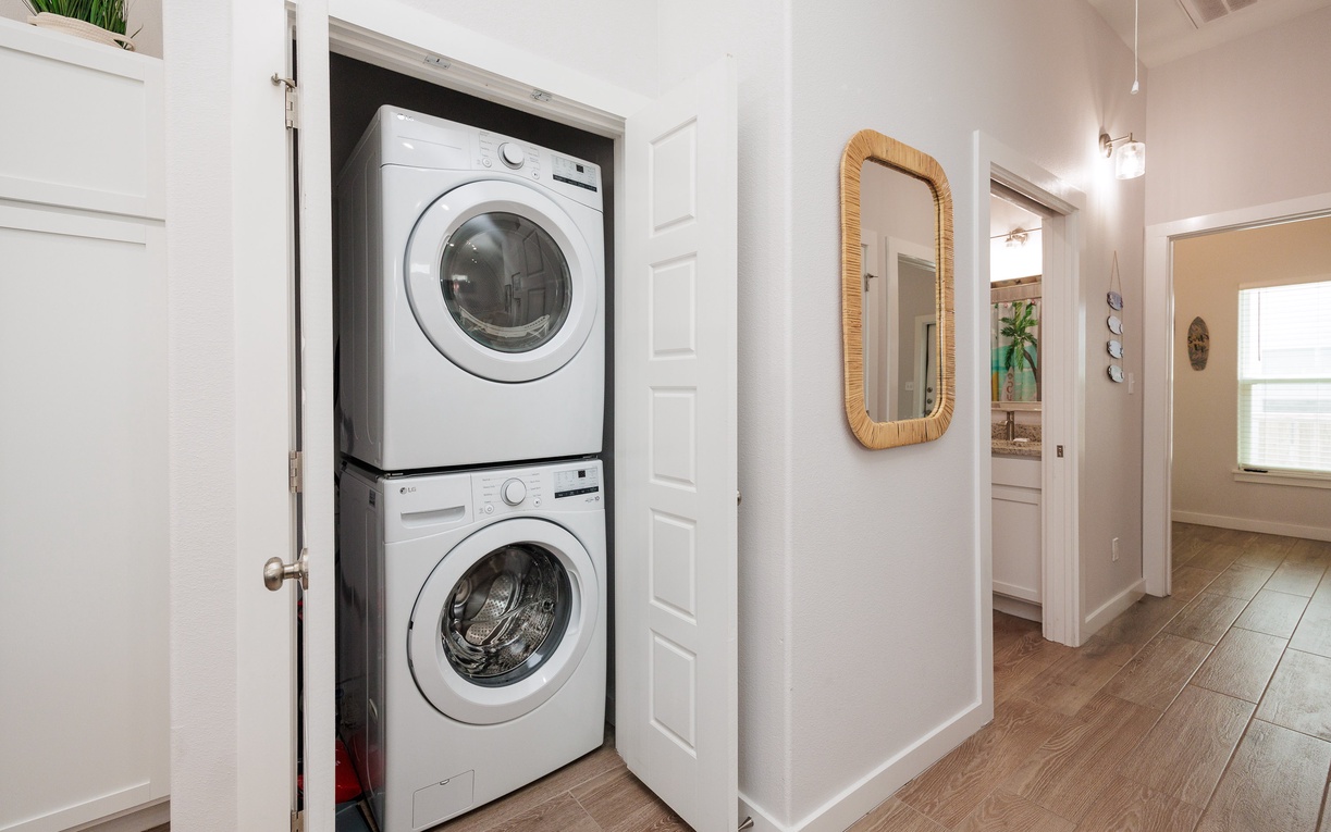 Your in-unit washer and dryer are cleverly tucked away in this hallway closet, making laundry day convenient and effortless.
