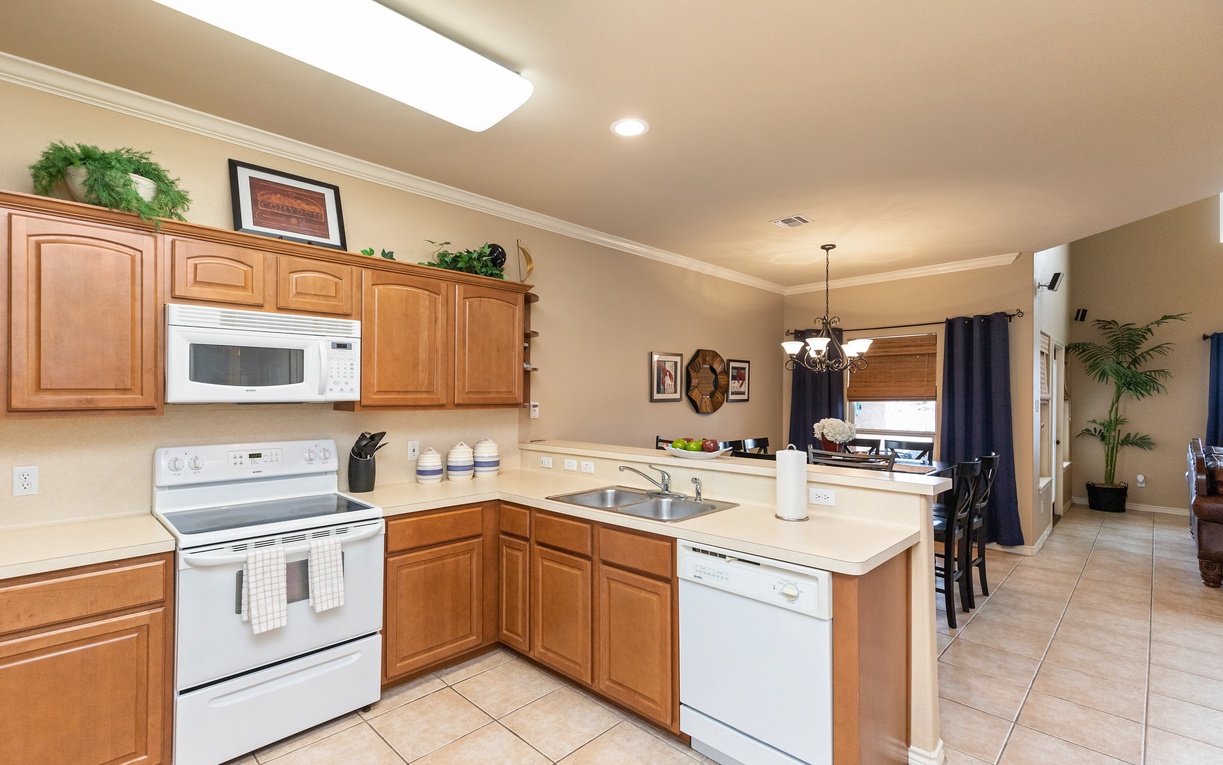 Your fully equipped kitchen features warm wood cabinets, granite counters, and everything you need to create memorable meals.