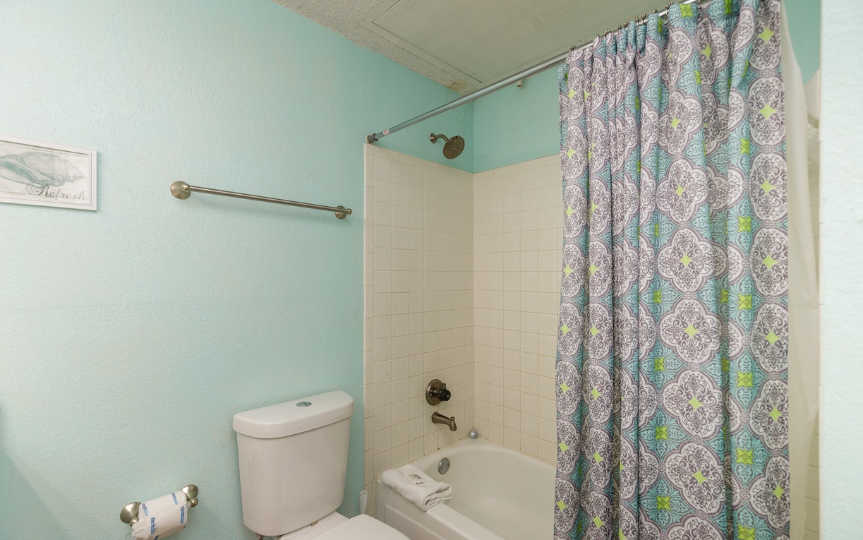 Refresh in your private bathroom with a full tub-shower combo and cheerful décor that brightens your morning routine.