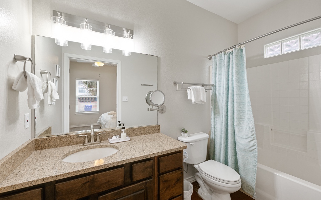 Your private bathroom features granite counters, designer lighting, and soft towels ready for your relaxing retreat.