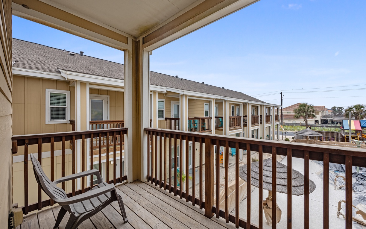 Relax on your private balcony with morning coffee, watching the coastal community come alive below.