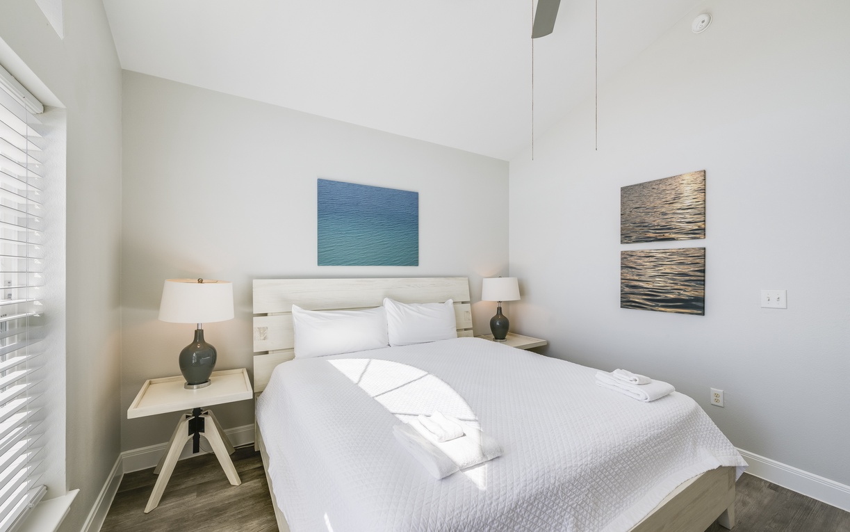 Drift off in your serene bedroom, where ocean-inspired artwork and soft natural light create the perfect sanctuary for restful nights.