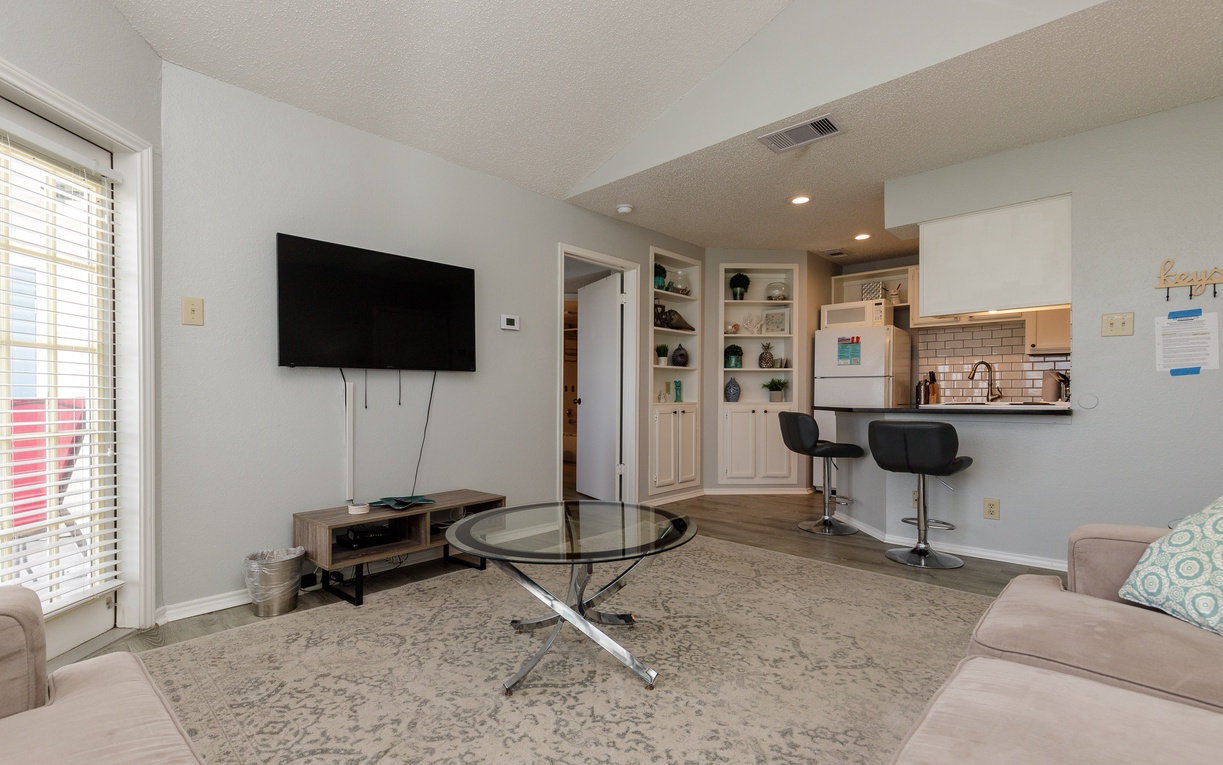 Unwind in your open-concept living space where modern comfort meets convenience. Watch your favorite shows while breakfast sizzles nearby.