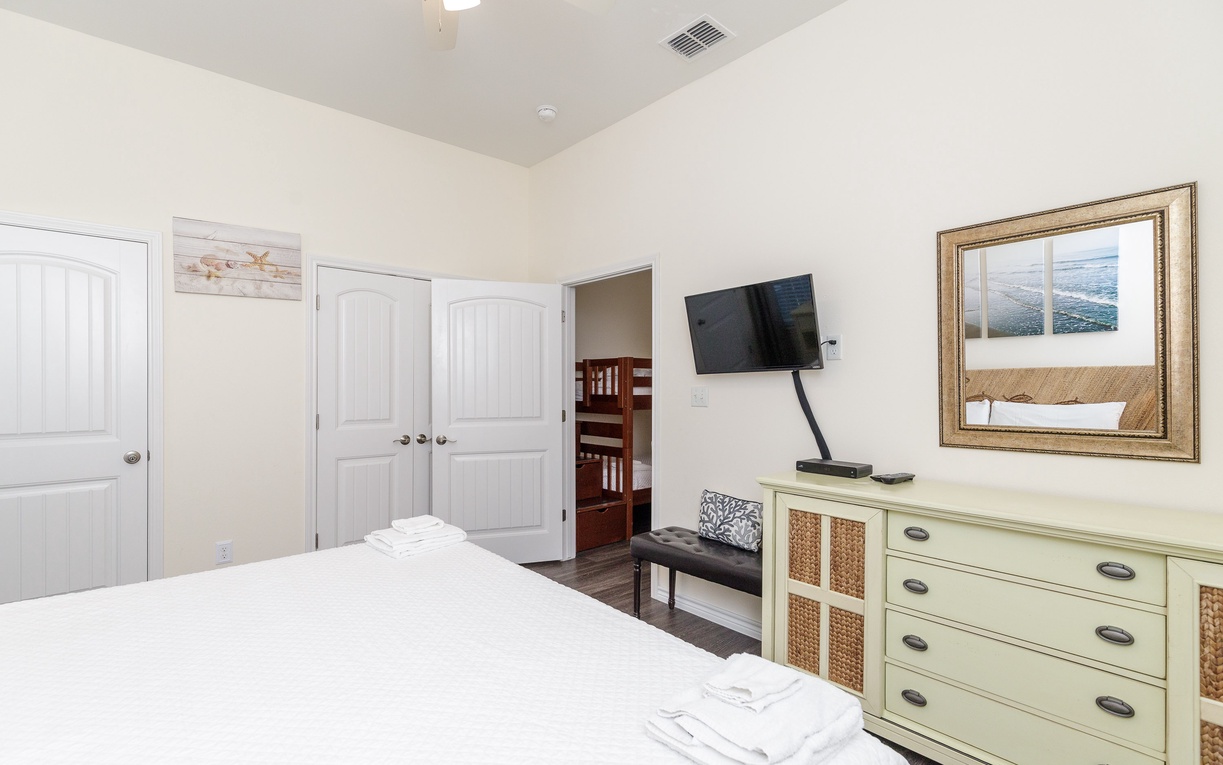 Unwind in your peaceful bedroom featuring crisp linens, modern entertainment, and elegant furnishings that create the perfect retreat.