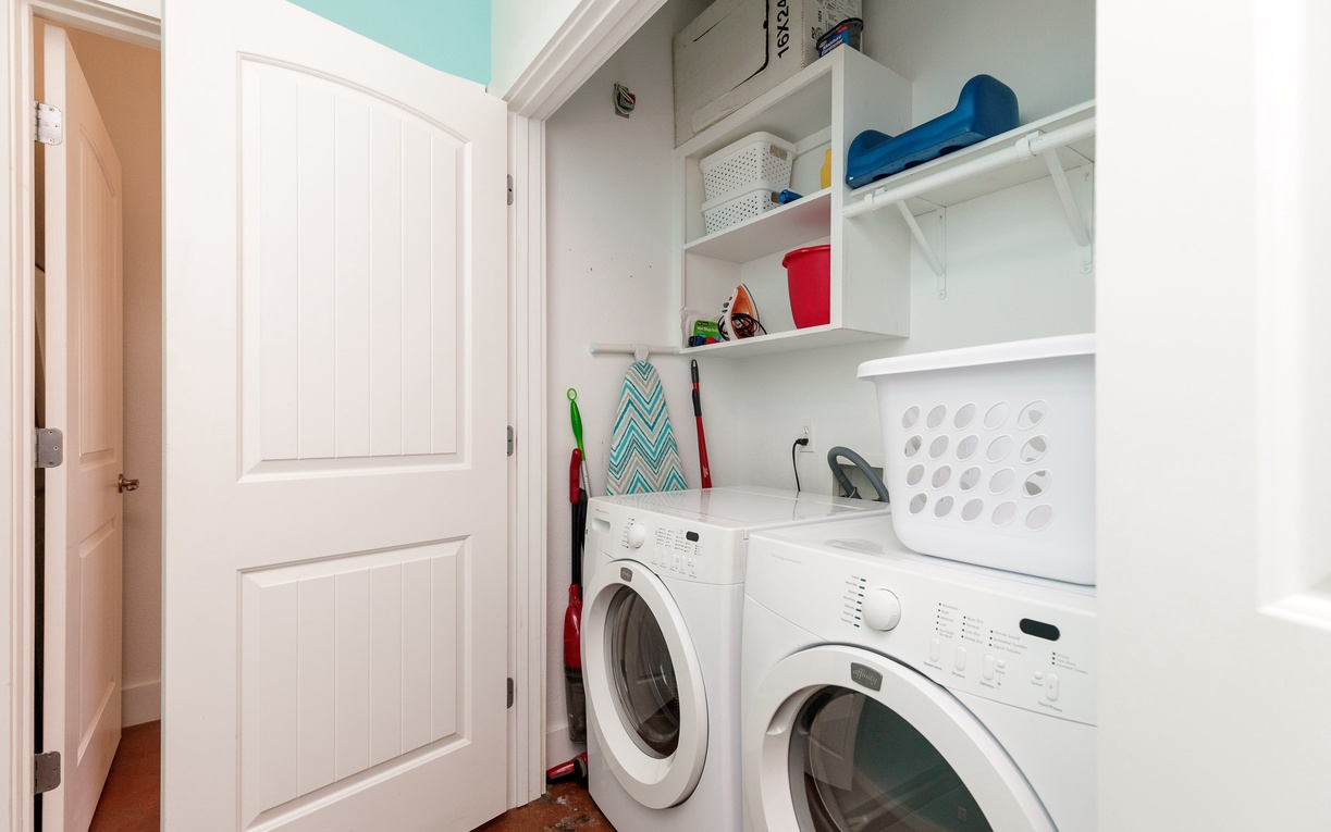 Your dedicated laundry room keeps your vacation wardrobe fresh with a full-size washer and dryer, plus organized shelving for all your essentials.