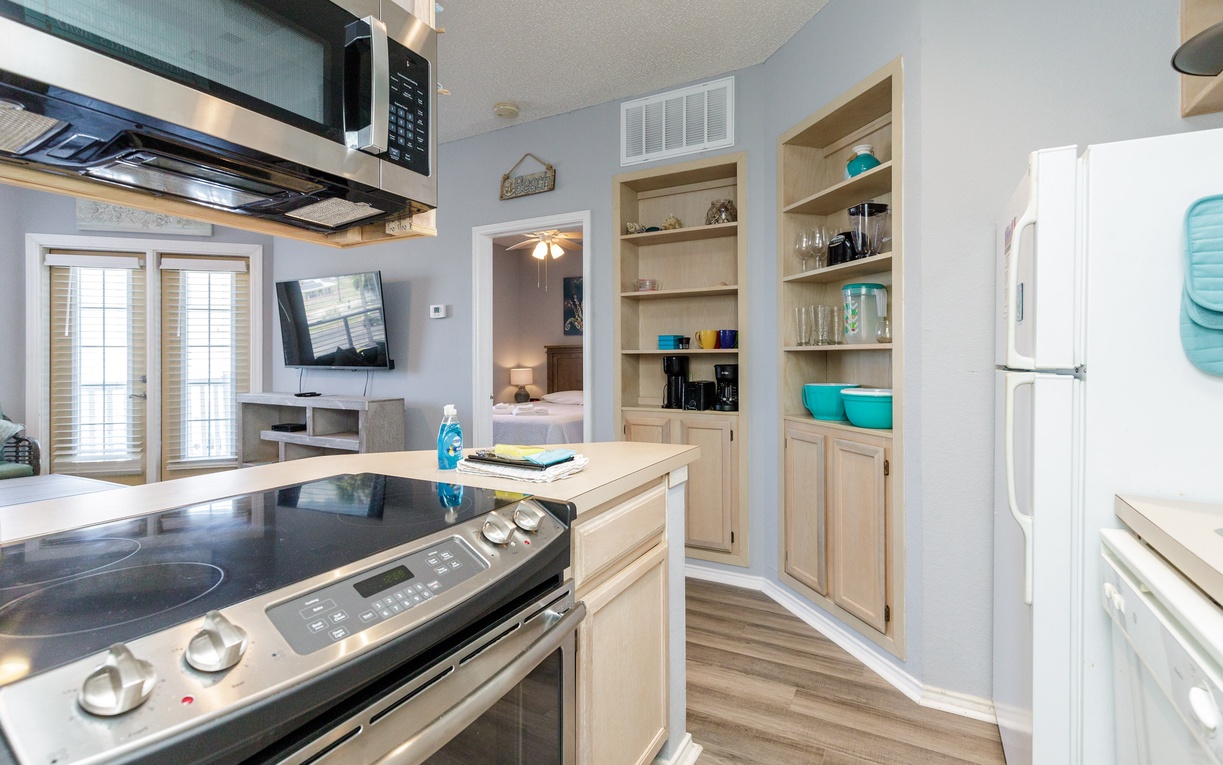 Your fully equipped kitchen features modern appliances and ample storage, perfect for preparing meals during your coastal getaway.
