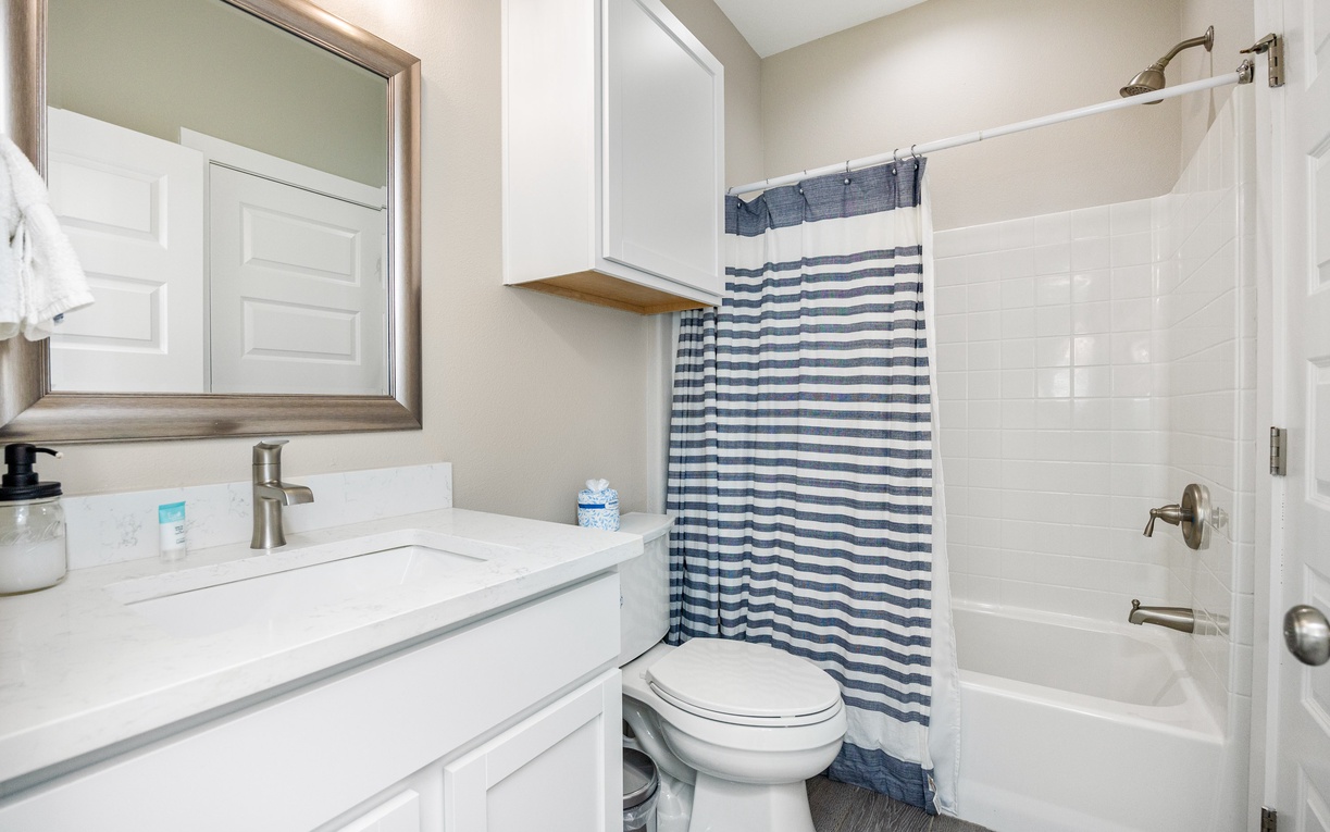Your bright, clean bathroom features modern fixtures and a relaxing tub where you can unwind after your adventures.