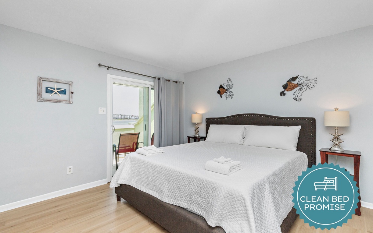 Sink into crisp white linens and enjoy peaceful nights in your private bedroom retreat with stylish decor and balcony access.