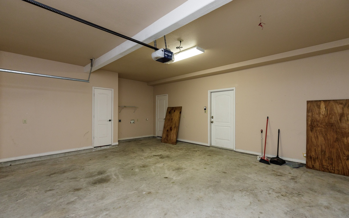 Spacious garage provides secure parking and ample storage space for your belongings during your stay.