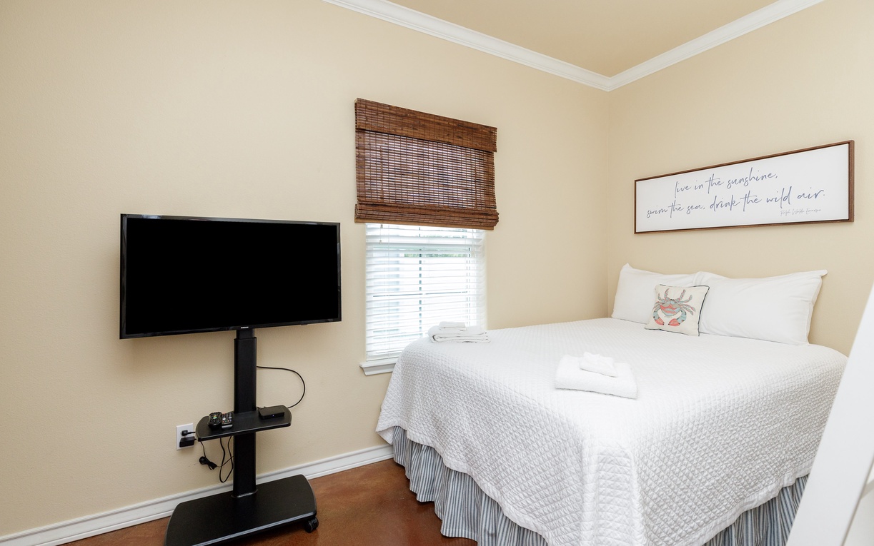 Unwind in your cozy bedroom with fresh linens, natural light, a queen size bed, and twin-over-twin bunk bed.