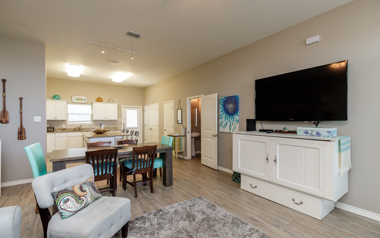 Step into your bright, open-concept haven where coastal charm meets modern comfort, perfect for relaxing evenings and memorable meals together.