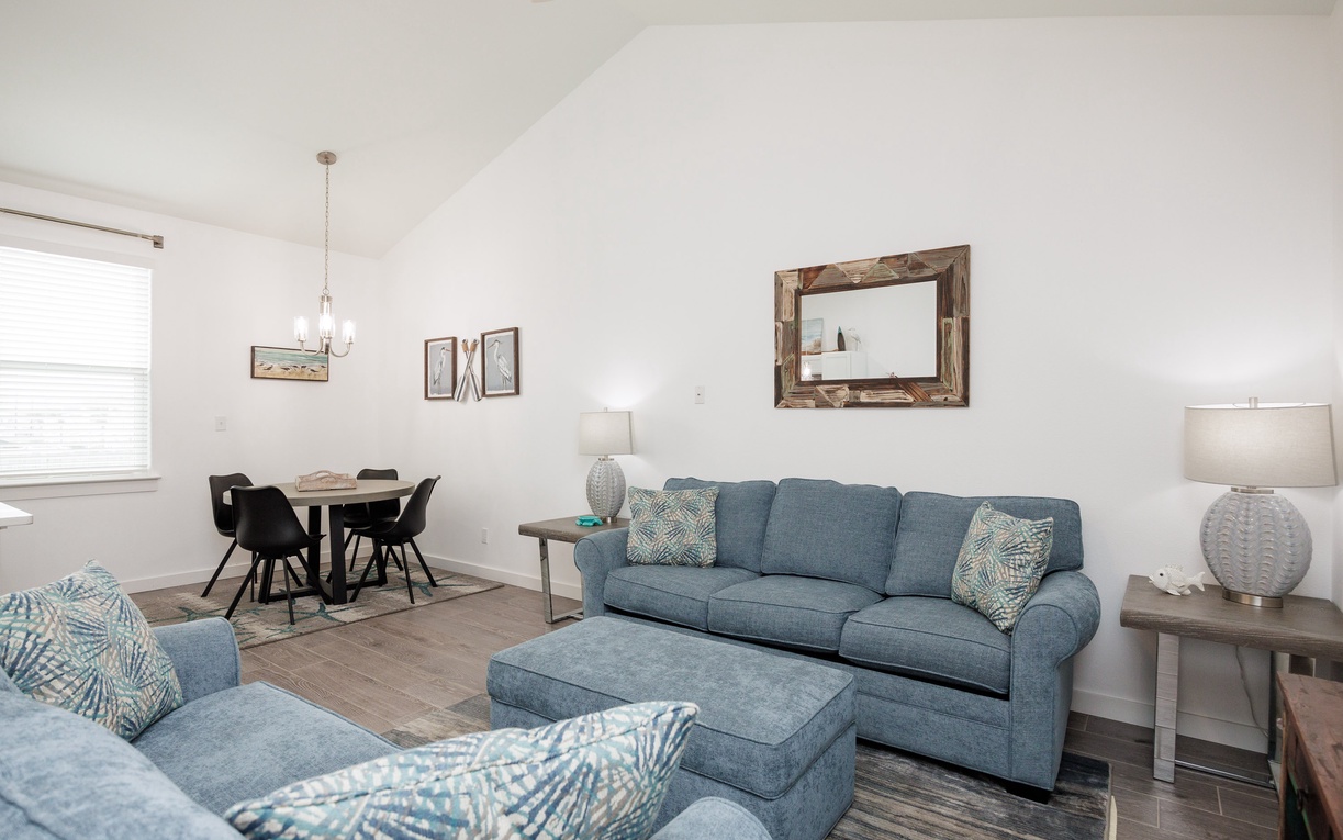 Unwind in your bright open-plan space with comfortable sofas and elegant dining area perfect for relaxing after exploring.