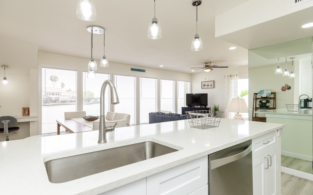 Your gourmet kitchen island overlooks the bright living space, where you'll love cooking while staying connected with family and friends relaxing nearby.