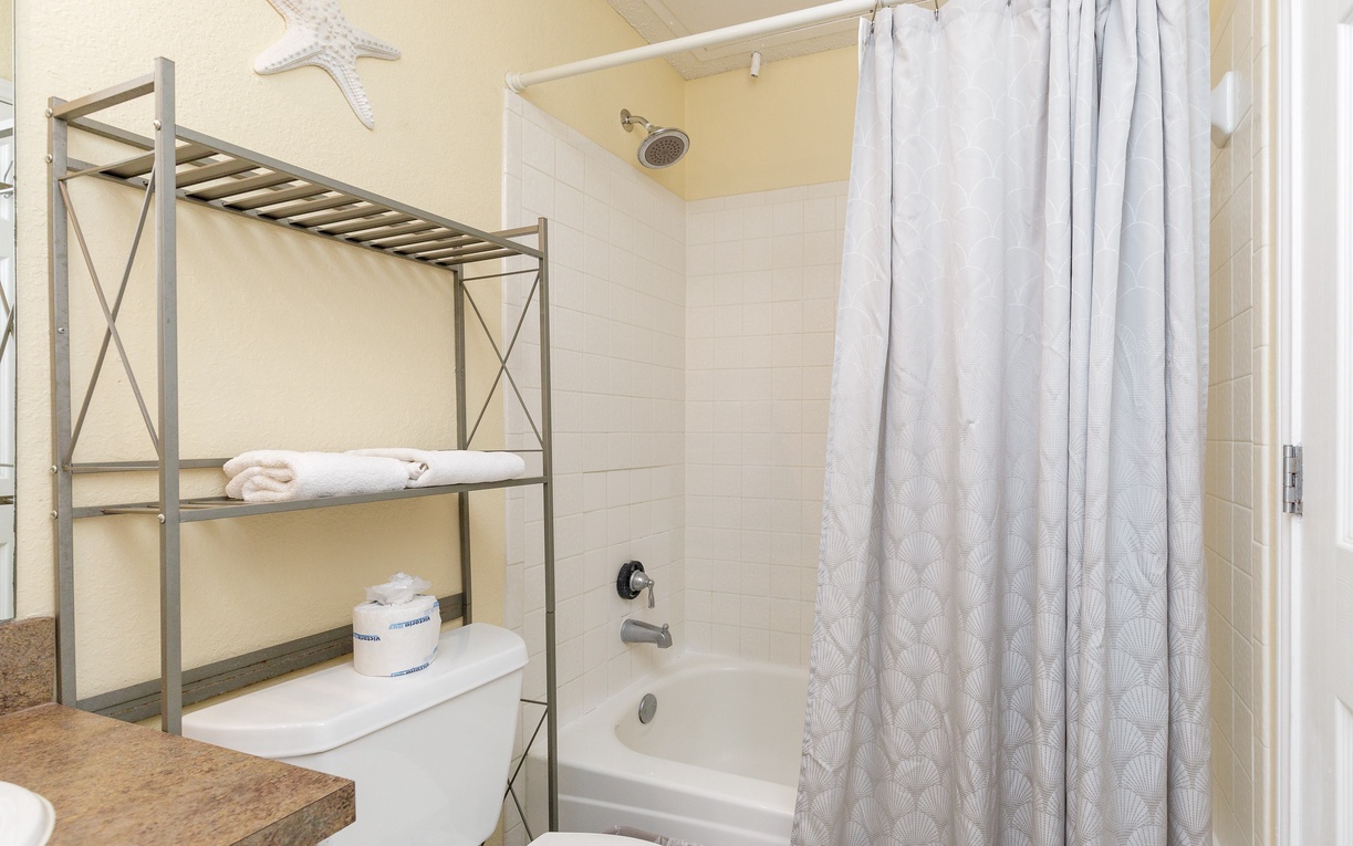 Refresh in your private bathroom with a relaxing tub-shower combo, fluffy towels, and thoughtful storage.