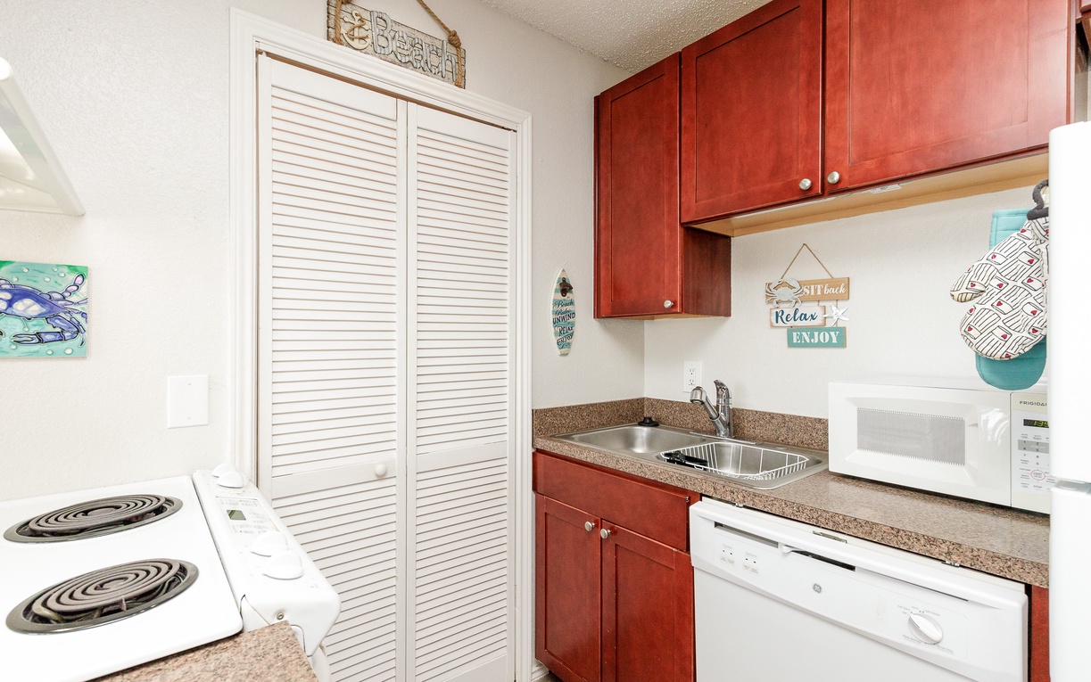 Your fully equipped kitchenette features warm cherry cabinets, granite countertops, and everything you need to prepare meals—from the stovetop to dishwasher.